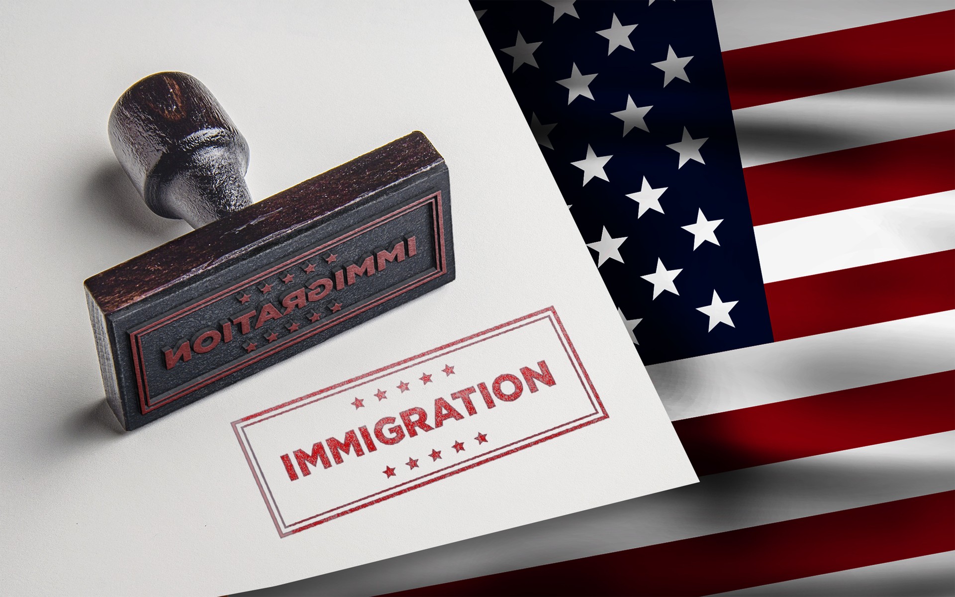 Immigration rubber stamp with United States of America flag background